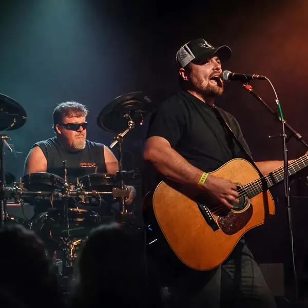 Jordan Beem and drummer Johnny G performing on stage