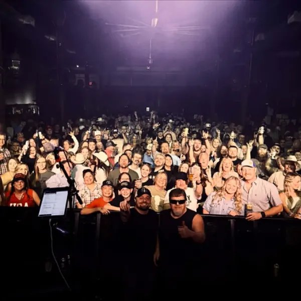 Packed crowd in front of the stage at an indoor Jordan Beem concert