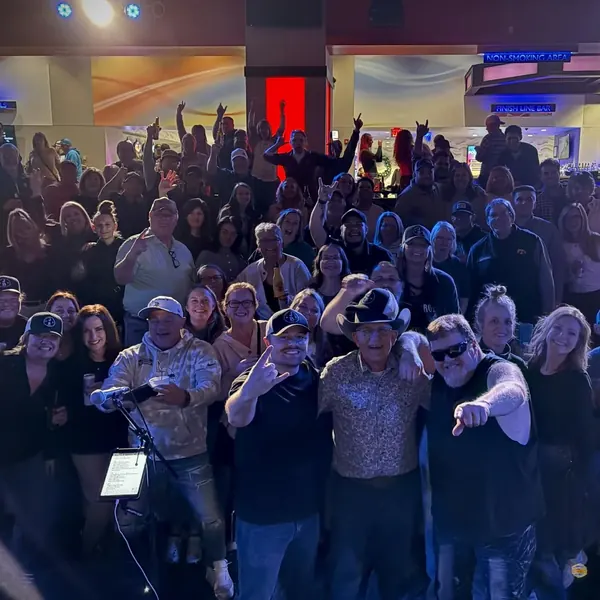 Fans cheering at an indoor Jordan Beem show