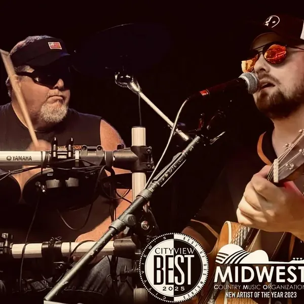 Jordan Beem and drummer Johnny G on stage, with Cityview Best and Midwest CMO award logos